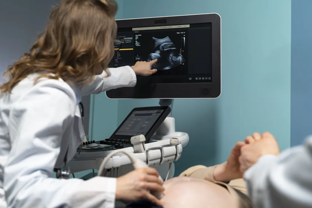 gynecologist performing ultrasound consultation